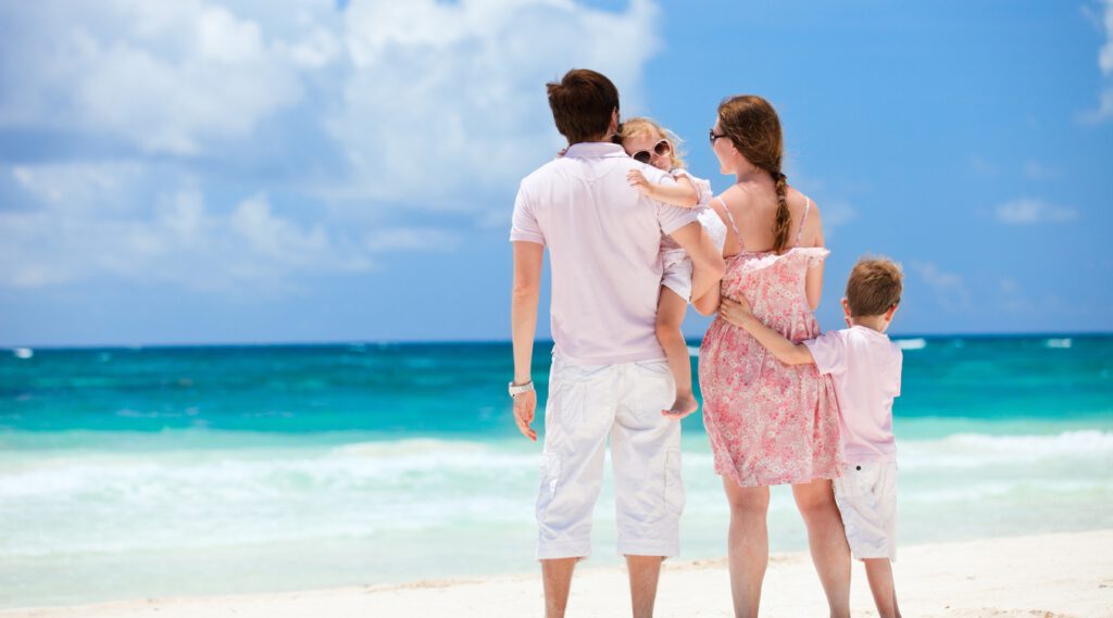 Family on the beach in Riviera Maya.